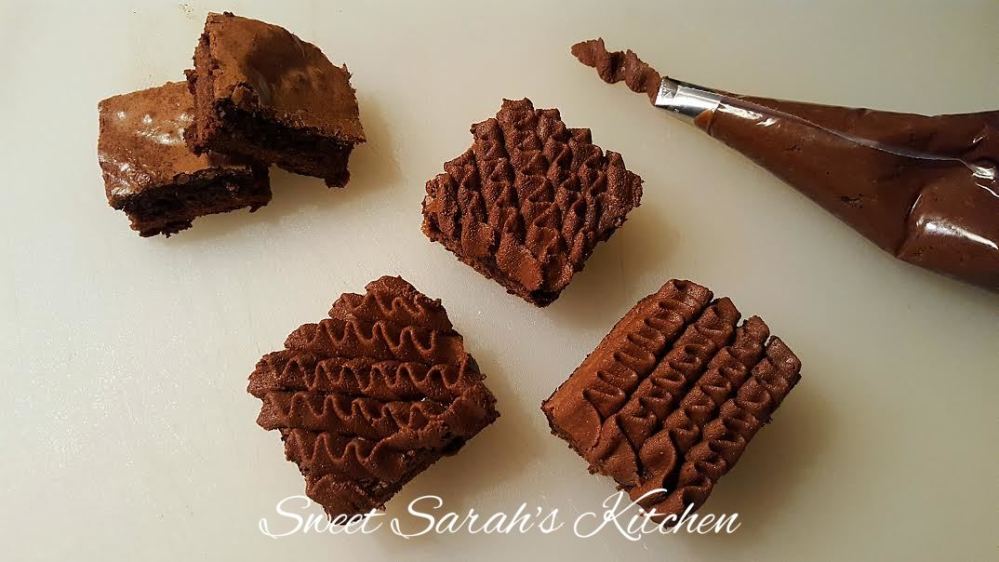 Mocha Fudge Brownie spread and piping